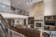 Presidential suite with fireplace, leather sectional sofa and dining table